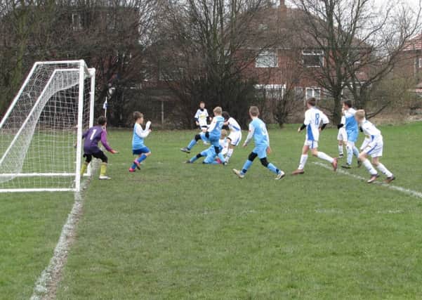 Leeds Schools FA Under-11s A in winning action at Scarborough.