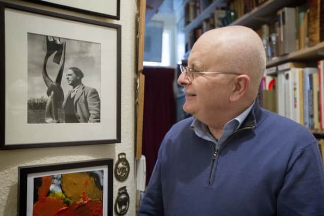 London-based art collector Tim Sayer, with some of his collection.