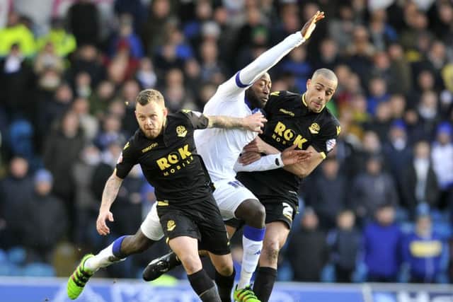 Jay Spearing and Darren Pratley combine to take the ball from Toumani Diagouraga.