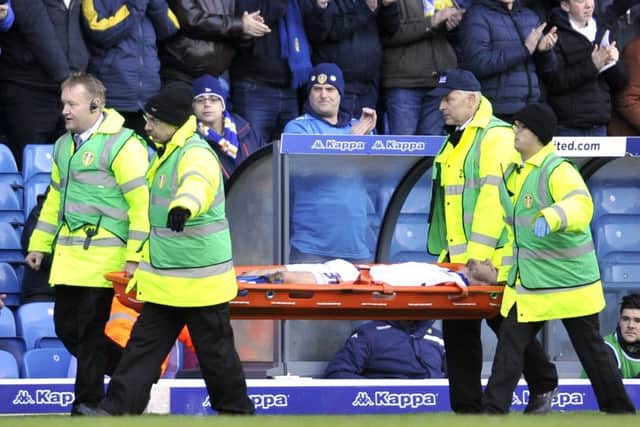 Lewie Coyle is stretchered off during Leeds United's match with Bolton on Saturday.
