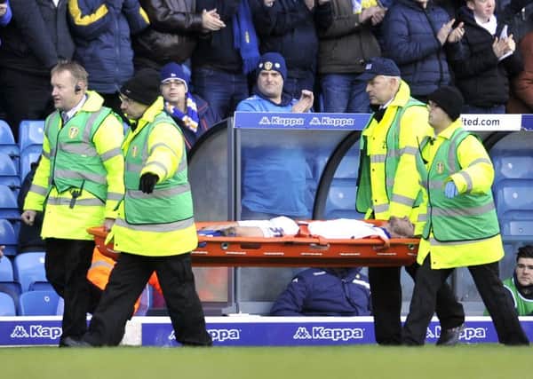 Lewie Coyle is stretchered off during Leeds United's match with Bolton on Saturday.
