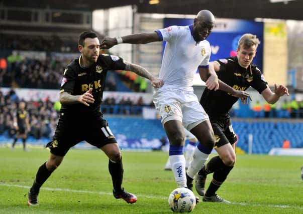 Souleymane Doukara is sandwiched by Mark Davies and Rob Houlding.