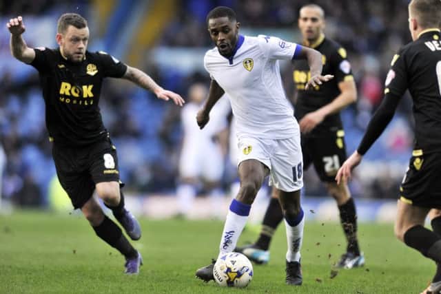 Mustapha Carayol weaves his way past Jay Spearing and Josh Vela.