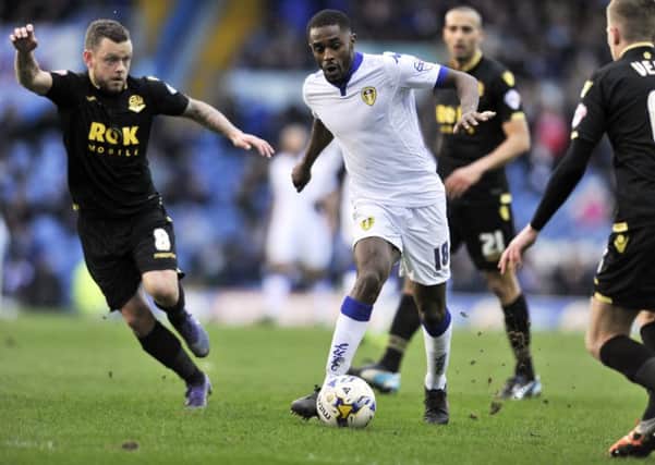 Mustapha Carayol weaves his way past Jay Spearing and Josh Vela.