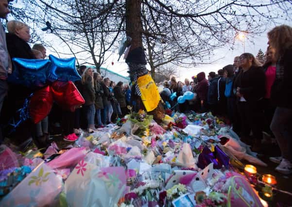 Family, friends and classmates gathered at a candle lit vigil at the scene of the crash in Morley last year. Picture by Ian Hinchliffe/ Rossparry.co.uk.