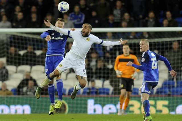 Guiseppe Bellusci, right, and Anthony Pilkington challenge for a high ball..  Picture: Bruce Rollinson