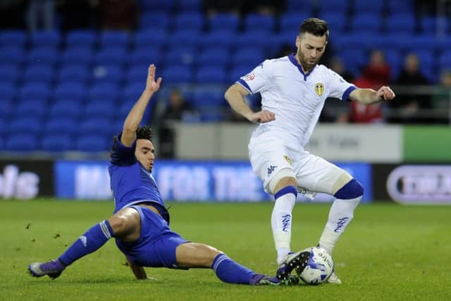 Cardiff City's Fabio da Silva flies in on Leeds United's Mirco Antenucci to receive his first yellow card.
 He was later sent off for a second bookable offence.  Picture: Bruce Rollinson
