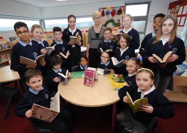 Headteacher June Turner with pupils in the new library at Beecroft Primary School, Kirkstall.