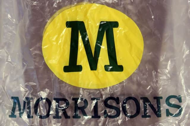 Morrisons posted an annual profit of Â£242 million, down from Â£345 million a year ago after closing a number of stores.
