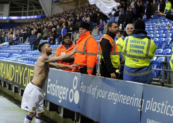 Mirco Antenucci throws his shirt to a fan at Cardiff.