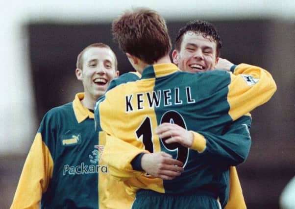 Harry Kewell is congratulated after scoring Leeds United's fourth goal against Derby County in 1998.