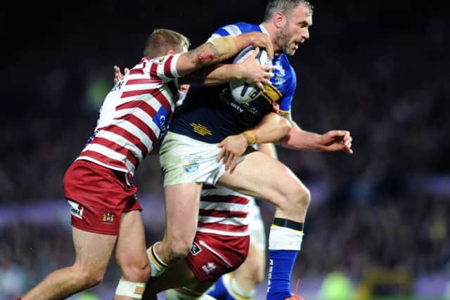 Super League Grand Final. Leeds Rhinos v Wigan warriors. Jamie Peacock is tackled. 10th October 2015. Picture : Jonathan Gawthorpe