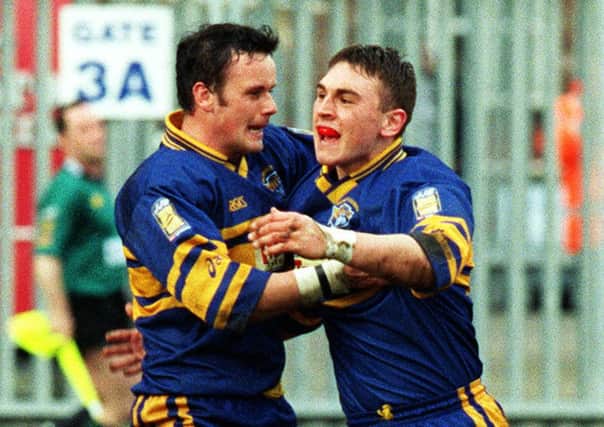 Francis Cummins celebrates with Kevin Sinfield.
