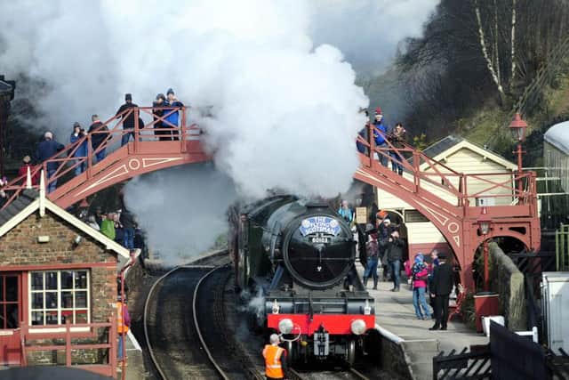 The Flying Scotsman steams through Goathland station, made famous in the Heartbeat TV series, in the North York Moors National Park, on its way from Grosmont to Pickering on its first day on the North Yorks Moors Railway.