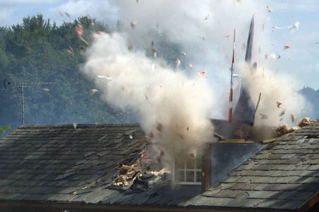 The helicopter crashing into the Emmerdale Village Hall.