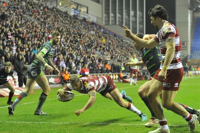 Wigan Warriors' Dominic Manfredi scores his sides 3rd try
First Utility Super League match at the DW Stadium Stadium, Wigan. Picture by Dave Howarth for BERNARD PLATT. Picture date: Friday March 11, 2016