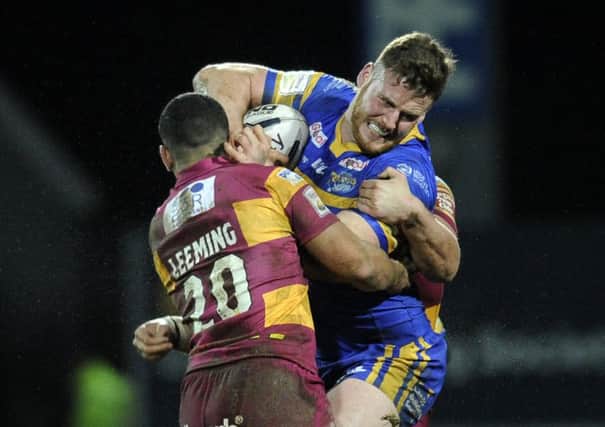 Anthony Mullally is held by Kruie Leeming and Nathan Mason of Huddersfield Giants. (Picture: Bruce Rollinson)