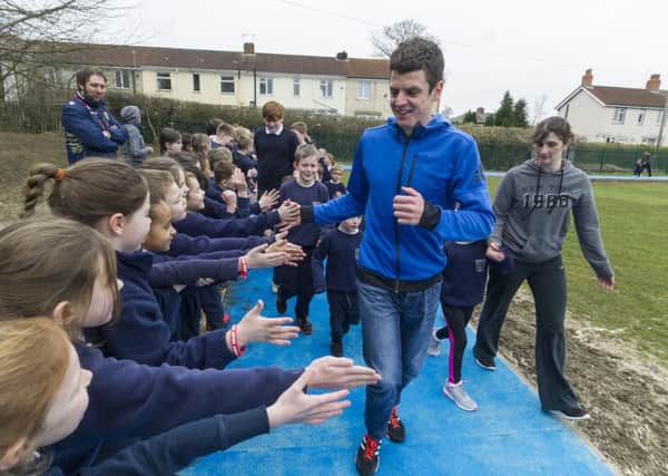 Jonny Brownlee gets a hero's welcome as he officially opens the running track at Thorner Primary School.