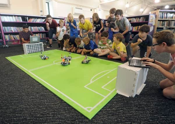 Grants are available for kids activities like this Robot Football tournament.