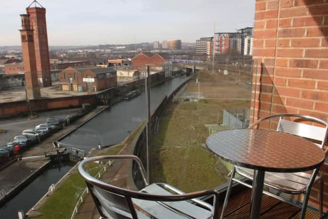 A view  of the Leeds Liverpool canal from a balcony of a two bed apartment in   Candle House at Granary Wharf in Leeds.