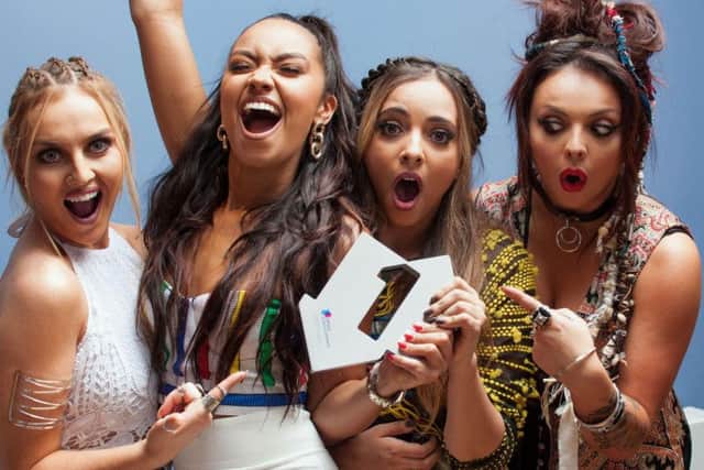 Little Mix celebrate Black Magic reaching No 1. Now the single has earned them two Brits nominations.
