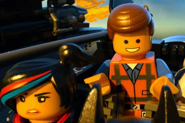 Film Still The LEGO Movie. Pictured: Wyldstyle (Elizabeth Banks), Emmet (Chris Pratt) and Vitruvius (Morgan Freeman). See PA Feature DVD DVD Reviews. Picture credit should read: PA Photo/Warner Home Video. WARNING: This picture must only be used to accompany PA Feature DVD DVD Reviews.