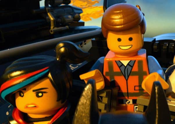 Film Still The LEGO Movie. Pictured: Wyldstyle (Elizabeth Banks), Emmet (Chris Pratt) and Vitruvius (Morgan Freeman). See PA Feature DVD DVD Reviews. Picture credit should read: PA Photo/Warner Home Video. WARNING: This picture must only be used to accompany PA Feature DVD DVD Reviews.