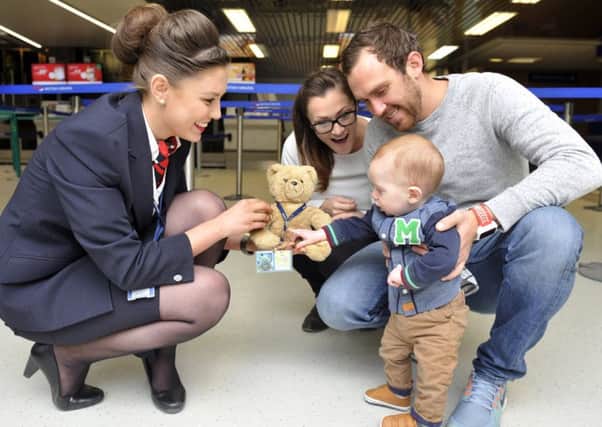 April Clements from British Airways with Scott and Coral Cranmer and their son Woody.
