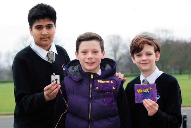 Students from Guiseley School, Fraz Raja, Rory Droogmans and Josh Winter, with their warm-E heated jacket.  Picture : Jonathan Gawthorpe