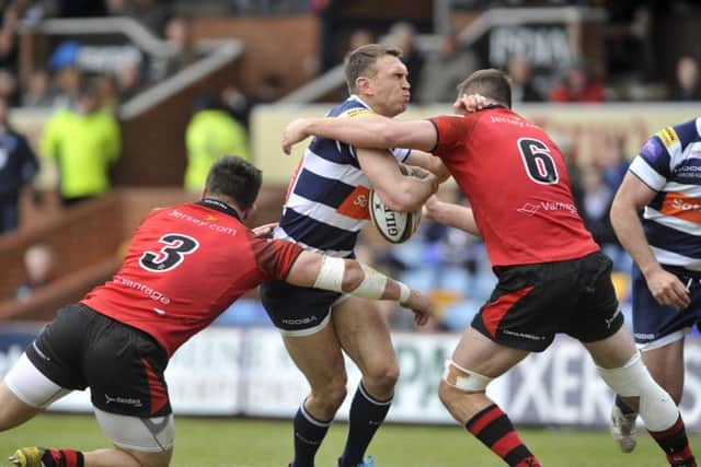 Yorkshire Carnegie's 
Kevin Sinfield is tackled by Simon Kerrod and Alex Rae. Picture: Steve Riding.