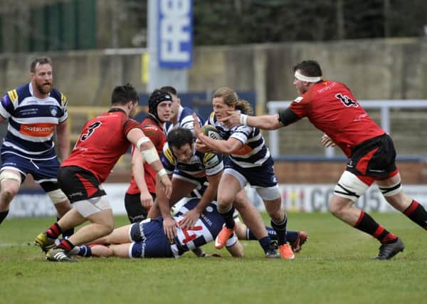 Yorkshire Carnegie's 
Chris Pilgrim is tackled by Nick Campbell of Jersey. Picture: Steve Riding.