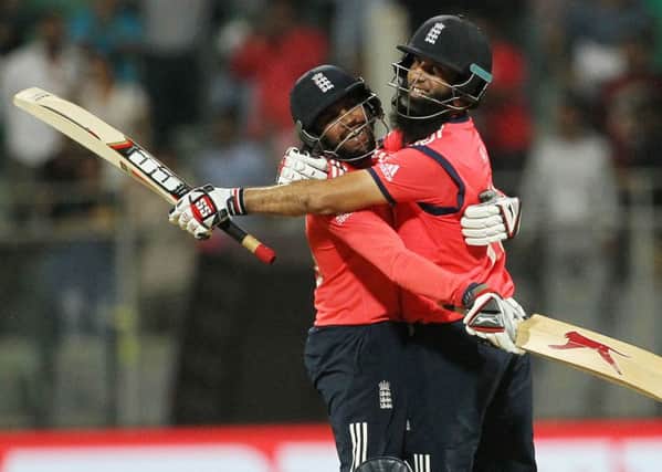 England's Adil Rashid left, celebrates with Moeen Ali after defeating South Africa in their ICC World Twenty20 2016 cricket match at the Wankhede stadium in Mumbai. (AP Photo/Rafiq Maqbool)