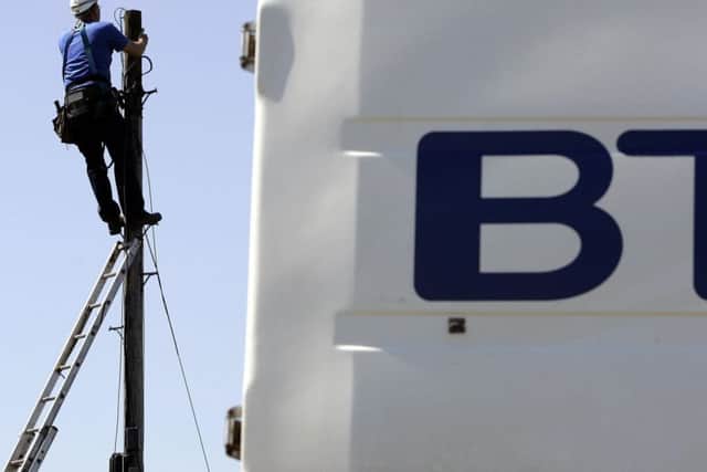A file photo of a BT worker up a telegraph pole Photo: Andrew Milligan/PA Wire