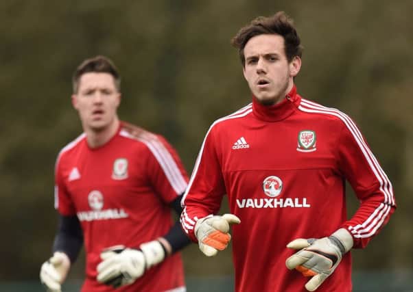 Wales goalkeepers Wayne Hennessey (left) and Danny Ward (right) during a training session at the Vale Resort, Glamorgan. PIC: PA