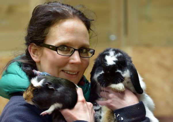 Animal keeper Lisa Bath with Barney the guinea pig and Sally the rabbit at Harewood.