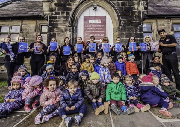 Children and staff celebrate Leeds Montessori Nurserys Ofsted.
