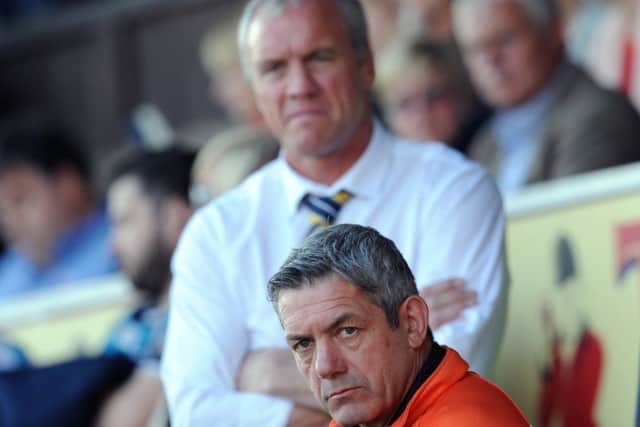 HAPPY DAYS: 
Castleford head coach Daryl Powell, front, goes head-to-head with Leeds Rhinos counterpart Brian McDermott on Thursday night.