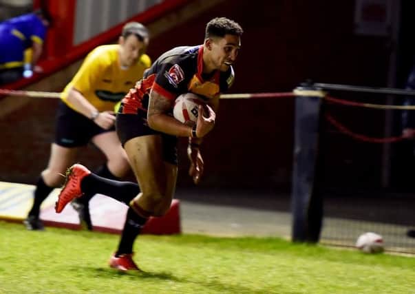 Rams winger Dalton Grant races over for a try during Dewsburys famous cup win over Bradford Bulls last Friday.