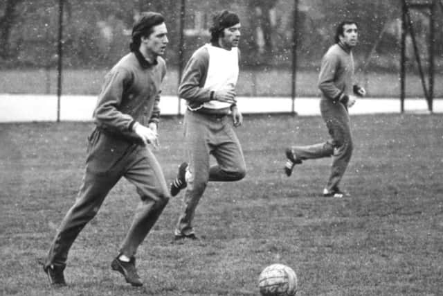 Dutch soccer superstar Johan Cruyff, left, training with other members of the Barcelona squad in a snowfall at Apperley Bridge, Bradford in April 1975.