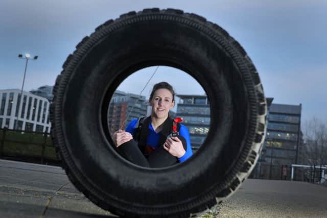 Female army reservist Stephanie Innes-Smith, who lives in the city centre and works at Irwin Mitchell, is hoping to be part of a special all-female army team which has been put together to cross the Antarctic land mass. She is currently training by hauling a giant tyre through the city of Leeds on her way to work. Picture Tony Johnson