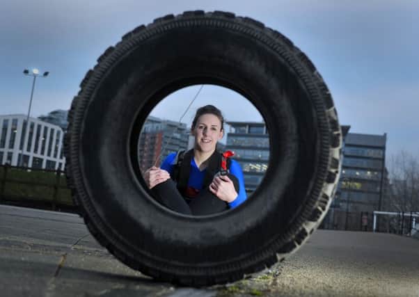 Female army reservist Stephanie Innes-Smith, who lives in the city centre and works at Irwin Mitchell, is hoping to be part of a special all-female army team which has been put together to cross the Antarctic land mass. She is currently training by hauling a giant tyre through the city of Leeds on her way to work. Picture Tony Johnson