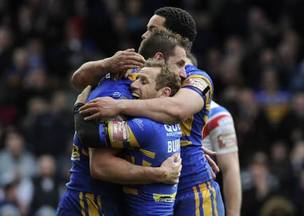 Rob Burrow celebrates Mitch Achurch's try against Wakefield on Easter Monday, but it was the Wildcats who eventually prevailed. Picture: Bruce Rollinson.