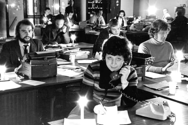 The YP editorial floor works on with the use of paraffin lamps and candles. February 1972
