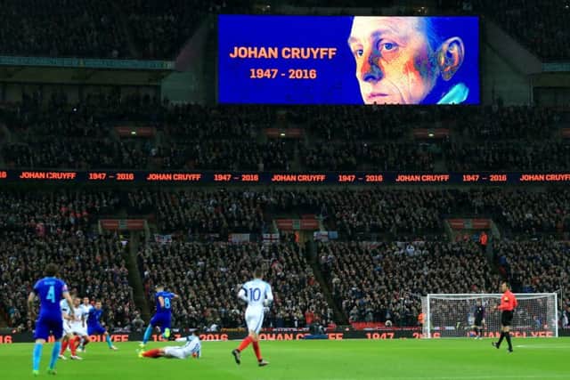 A tribute to Netherlands legend Johan Cruyff is shown on the giant screen throughout the 14th minute during the International Friendly match at Wembley. PIC: PA