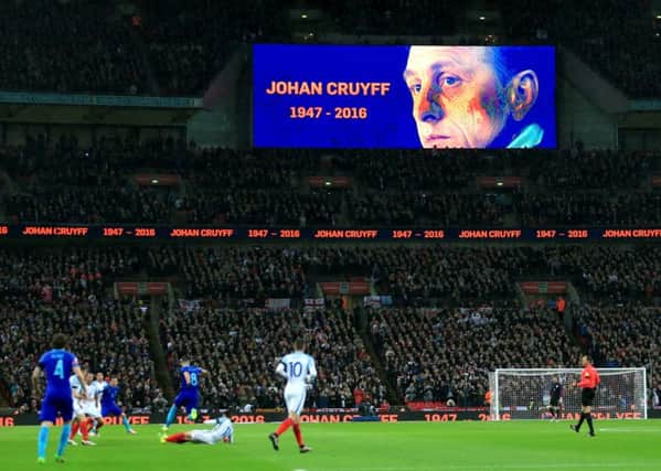 A tribute to Netherlands legend Johan Cruyff is shown on the giant screen throughout the 14th minute during the International Friendly match at Wembley. PIC: PA