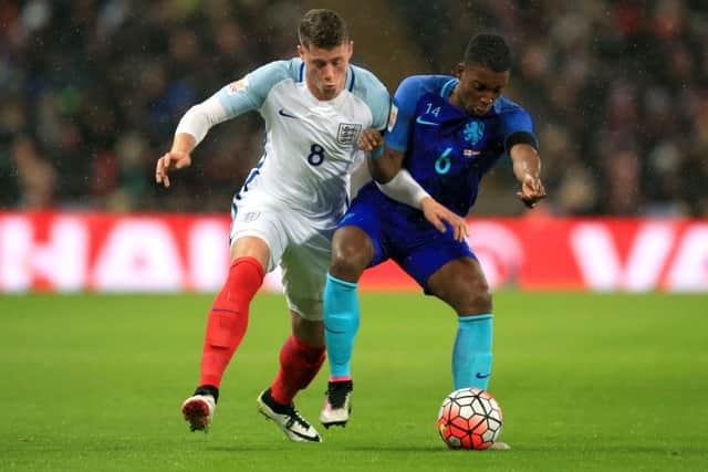 England's Ross Barkley (left) and Netherlands's Riechedly Bazoer battle for the ball. PIC: PA