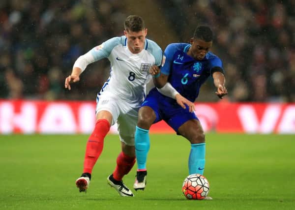 England's Ross Barkley (left) and Netherlands's Riechedly Bazoer battle for the ball. PIC: PA