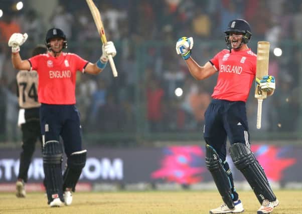 FINAL RECKONING: England's Jos Buttler, right and Joe Root celebrate after defeating New Zealand Picture: AP/Manish Swarup.
