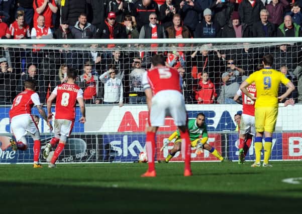 Rotherham's Greg Halford scores a penalty past Leeds sub keeper Giuseppe Bellusci. PIC: Tony Johnson