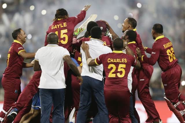 West Indies players celebrate after defeating England at Eden Gardens. Picture: AP/Saurabh Das